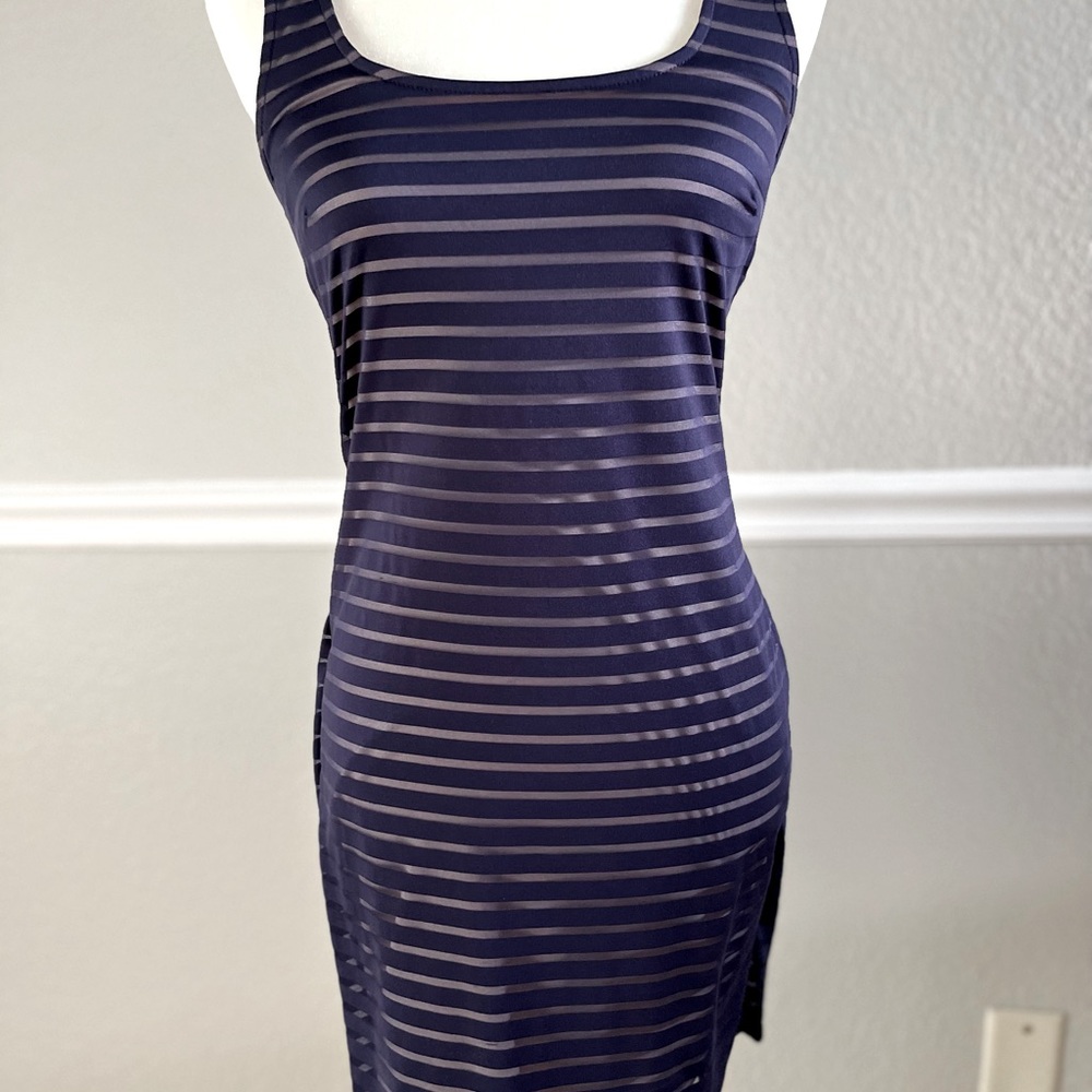 Jennifer Lopez at the knee dress. Tank top style with back cutout detail.